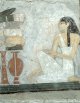 Egyptian_-_Woman_Kneeling_Before_an_Offering_Table_-_Walters_322